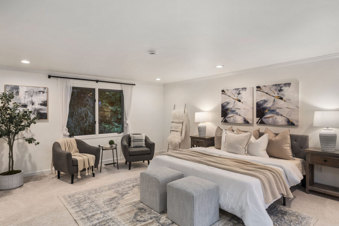 Staged bedroom with cozy winter blankets and pillows in Issaquah home