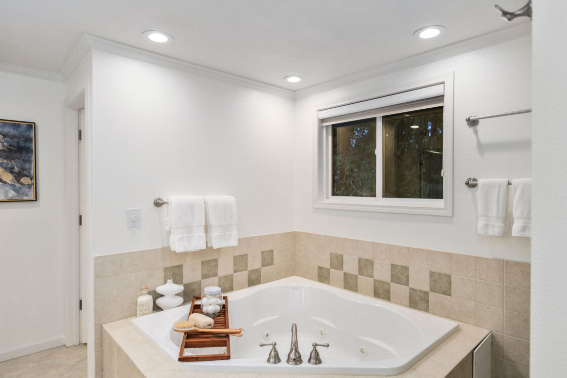 Spa-like bathroom staged with premium accessories in a Clyde Hill home