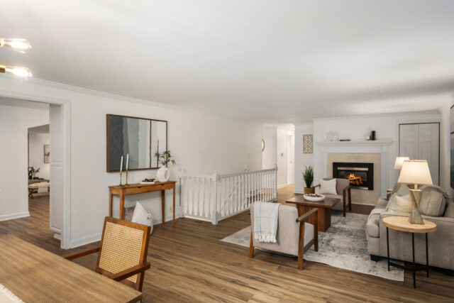 Living room staged with neutral walls and colorful accents in Snohomish County