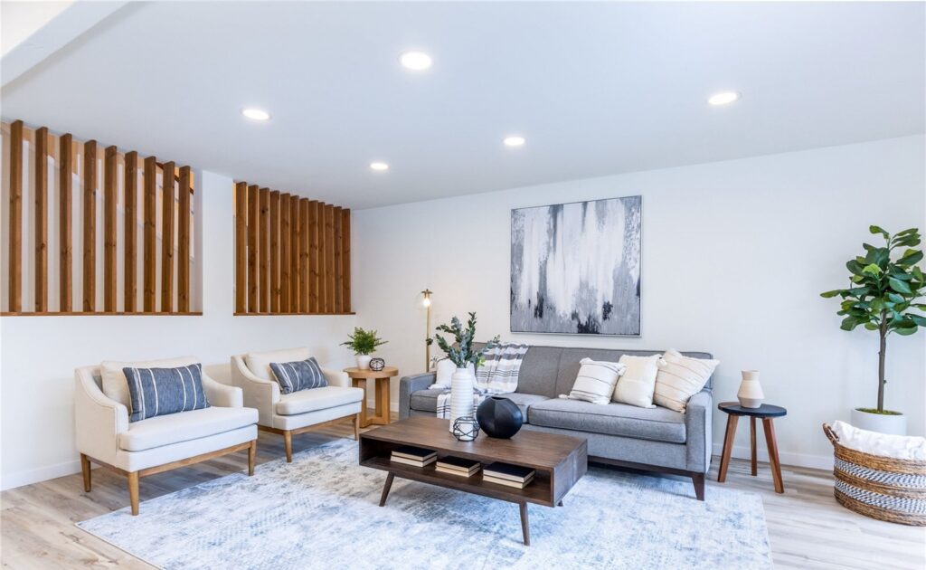 Redmond home staging in a modern townhome living room with slatted wood accents and large-scale art