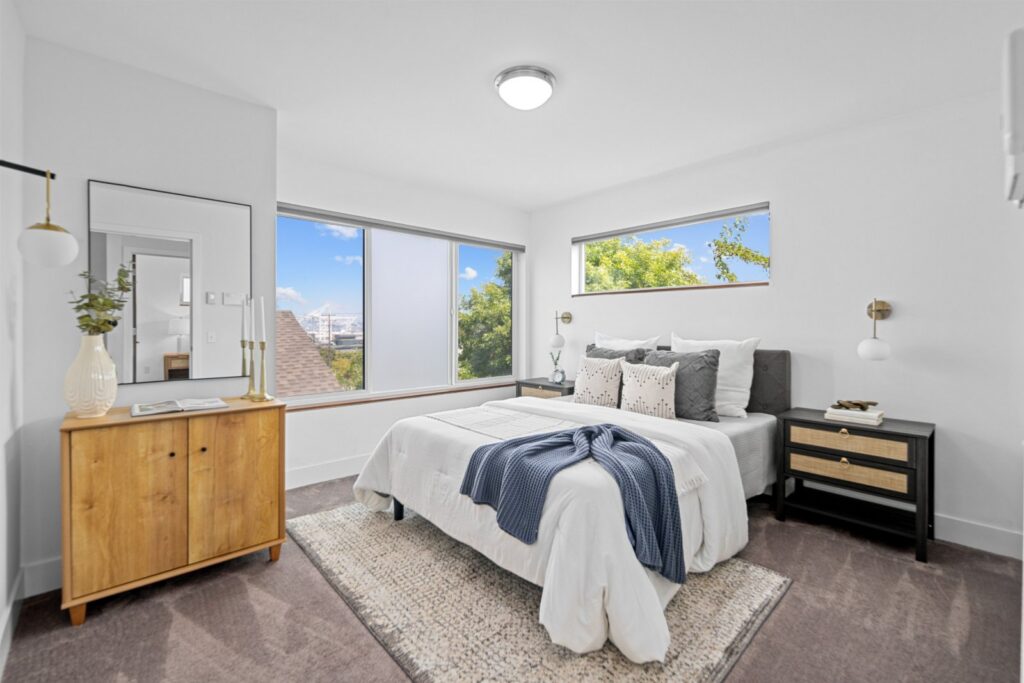 Bedroom with a view, layered bedding and woven accents