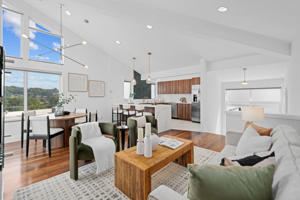 Dining area with a wood table and chairs, open to the kitchen