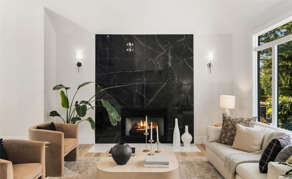 Living room with black marble fireplace in a Newcastle home, staged by IntExt, a Seattle staging company