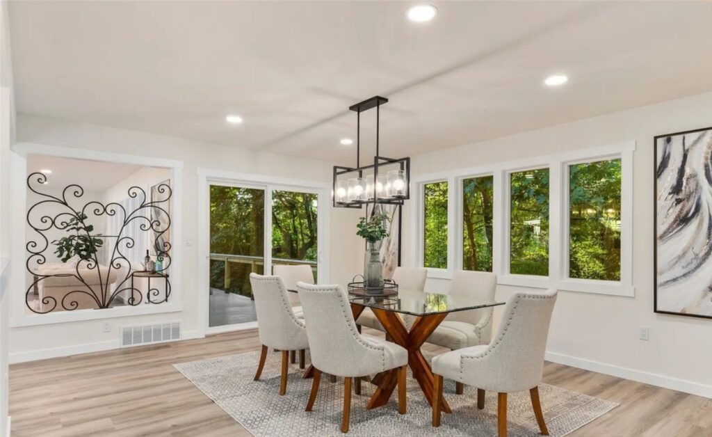 Normandy Park dining room with glass table and upholstered chairs, designed by IntExt