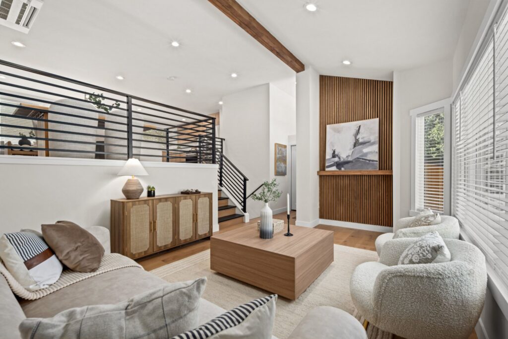 Living room with a wood feature wall, large-scale coffee table and layered seating