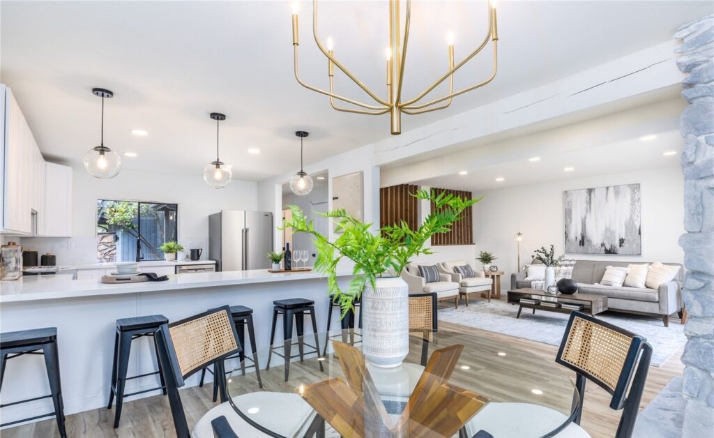 Redmond dining room and kitchen with chandelier, designed by IntExt
