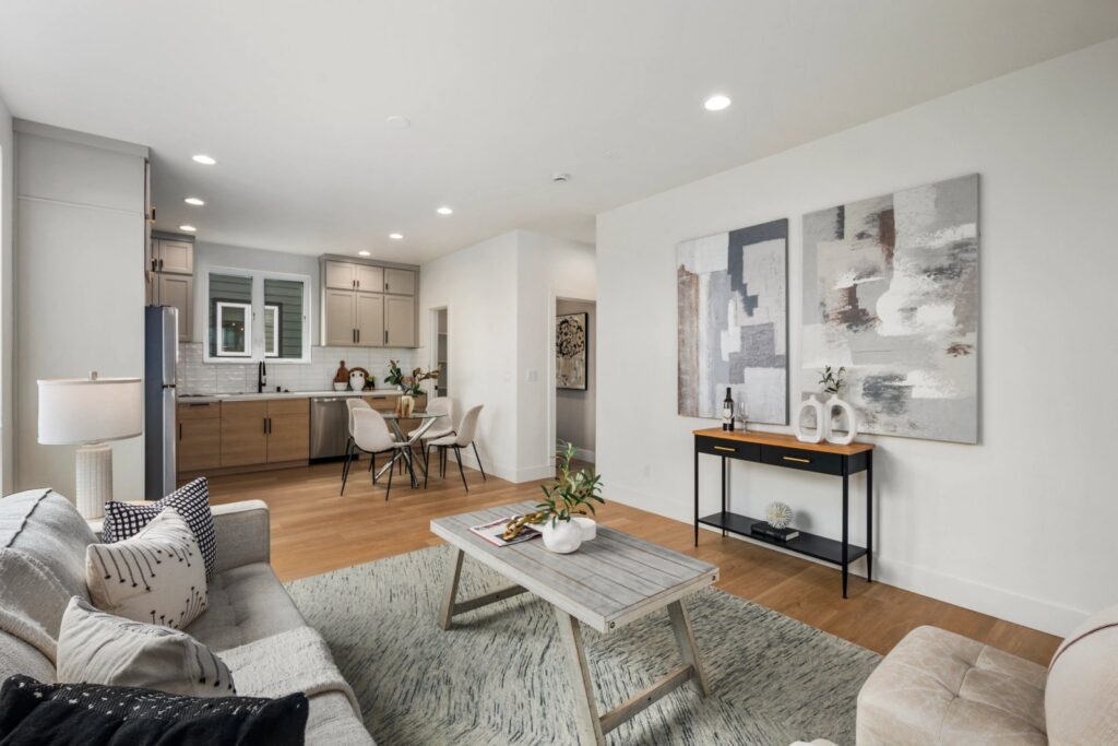 Open living and dining area in Seattle with right-sized furniture and a rug defining each space