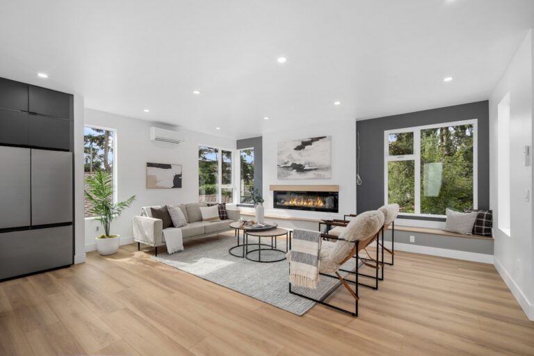 Vacant home staging in a Seattle townhouse living room with a fireplace, sofa and lounge chairs